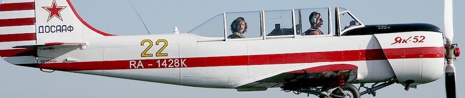 Closeup of Yak 52 in flight